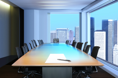 meeting room, in front focus placed sheet of paper and pen on table